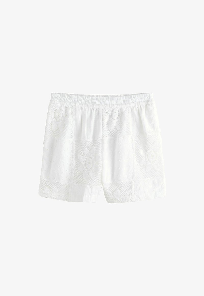 Hvide blondershorts med elastisk talje og blomsterprint på stoffet, vist mod en ensfarvet hvid baggrund.