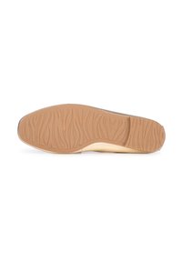 Zool van een schoen met een textuur van rubber in lichtbruin, voorzien van geprofileerde groeven voor grip en een gladde rand.