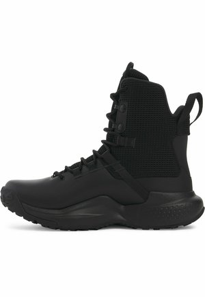 Black ankle boots with a textured mesh body, smooth synthetic material, round toe, secure lace-up design, and padded collar for support.