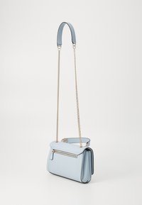Light blue textured shoulder bag with gold chain strap, zip pocket, and a flap closure, featuring a structured shape and contrasting black trim.