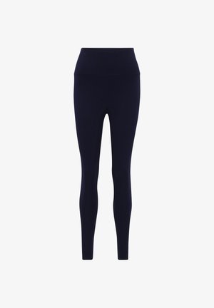 Granatowe legginsy wykonane z elastycznego materiału z wysokim stanem, charakteryzujące się gładką teksturą i dopasowanym krojem. Bez widocznych wzorów ani akcentów.