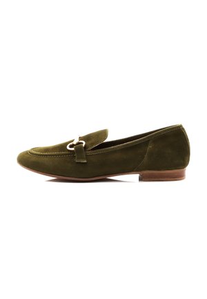 Green suede loafer with a rounded toe, decorative strap, and small metal accent, featuring a low wooden heel and smooth texture.