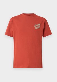 Short-sleeve t-shirt in red cotton with a crew neck. Features "Santa Cruz" logo in a contrasting color on the left chest.
