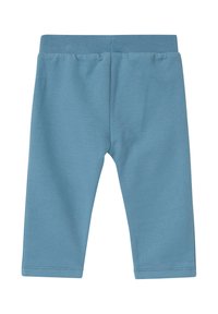 Blauwe katoenleggings met een elastische tailleband, een gladde textuur en een enkellange snit. Eenvoudig en simpel ontwerp zonder patronen of accenten.
