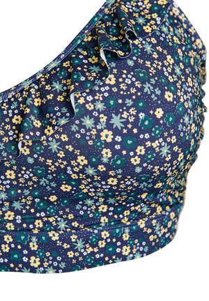Navy blue swimsuit top with small yellow, green, and white floral pattern, featuring a ruffled one-shoulder design and ruched sides.