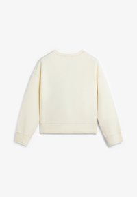 Sudadera color crema con mangas largas, cuello redondo y dobladillo acanalado. Tejido suave con una textura lisa y silueta cuadrada.