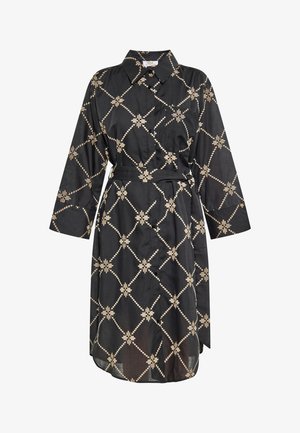 Schwarzes Hemdkleid mit Kragen, langen Ärmeln und tailliertem Bund, das ein geometrisches beige Muster auf dem Stoff aufweist.