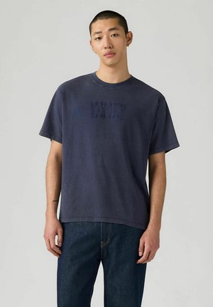 Navy blue cotton t-shirt with a round neckline and short sleeves. Features a subtle logo in a slightly darker shade across the chest.