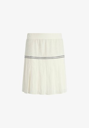 Gonna a pieghe bianca con una vita tessuta a trama, dettaglio a righe orizzontali nere e corpo svasato per un silhouette morbida.