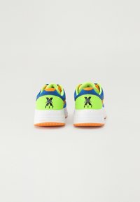 Sport shoes featuring a blue, green, and orange design. Textured fabric upper, cushioned sole, and vibrant color accents with logo detail.