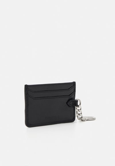 Black leather cardholder with a smooth texture, featuring multiple card slots, a chain attachment, and embossed branding on the front.