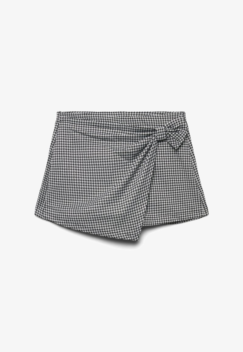 Czarna i biała spódnica w deseń houndstooth z detalem w postaci węzła z boku oraz miękką fakturą tkaniny; asymetryczny dół dodaje wizualnego zainteresowania.