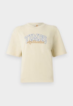 Cream short-sleeve t-shirt featuring "TIMBS Authentic" in blue and gold lettering. Made from soft cotton with a relaxed fit.