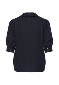 Blouse bleu marine avec manches trois-quarts bouffantes, poignets boutonnés et une petite étiquette IW.EDITION sous le col au dos.