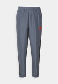 TIRO25 ESSENTIALS WOVEN - Pantaloni sportivi - team onix/super orange