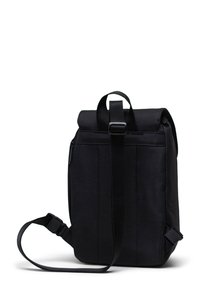 Black fabric backpack with a roll-top design, adjustable strap, and side zipper. Features a sturdy handle and clean lines.