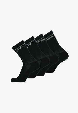 Svarta bomullssockor, ankle-length, med ribbat mönster och vitt logotyp längs den övre bandet. Säljs i ett set om fyra par.