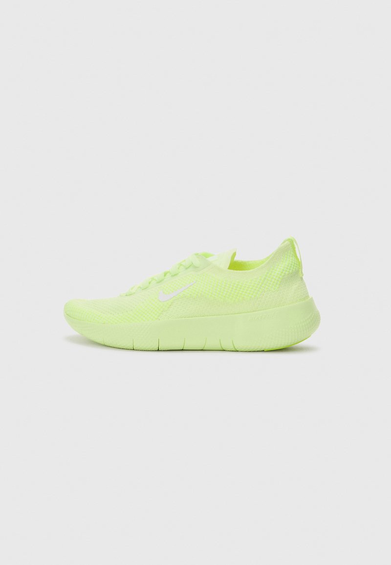 Lime green mesh athletic shoe with a textured surface, rounded toe, laces on top, and a cushioned sole featuring horizontal grooves.