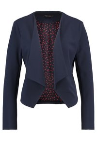 Námořnicky modrá bunda s volně splývajícím předním dílem, dlouhými rukávy a červenou podšívkou s puntíky. Vyrobená z hladké látky s minimem viditelných švů.