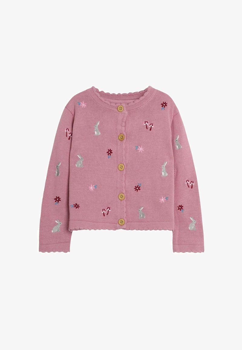 Rozā adīta kardigāna ar viļņotām malām, ar izšūtiem trušiem, ziediem un konfekšu nūjiņām. Priekšpusē piecas koka pogas.