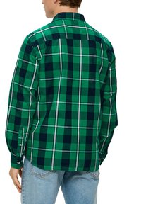 Grünes und marineblau kariertes Hemd mit langen Ärmeln, Knopfmanschetten und Kragen. Aus strukturiertem Stoff gefertigt und mit einem karierter Muster.