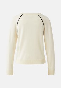 Cremefarbener Pullover mit langen Ärmeln, gerippten Bündchen und Saum, mit schwarzer Paspelierung entlang der Raglan-Ärmelnähte, Rückansicht.