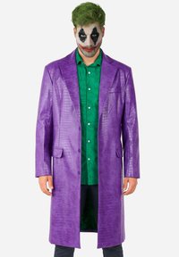Purple faux leather coat with a crocodile texture, button closure, and two front pockets, worn over a green shirt with a pattern.