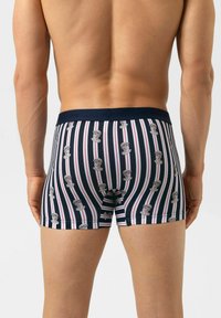 Boxers met een marineblauwe basis, verticale strepen en herhaalde grafische prints. De tailleband is effen marineblauw met branding.