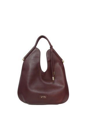 Borsa a mano in pelle bordeaux con un design unico del manico sagomato, texture liscia e dettagli in metallo color oro. Logo visibile sul davanti.