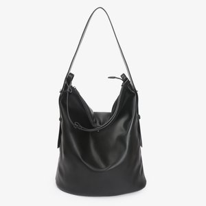 Borsa a spalla in pelle morbida nera con una sola tracolla e una zip superiore, leggermente morbida con un design minimalista.