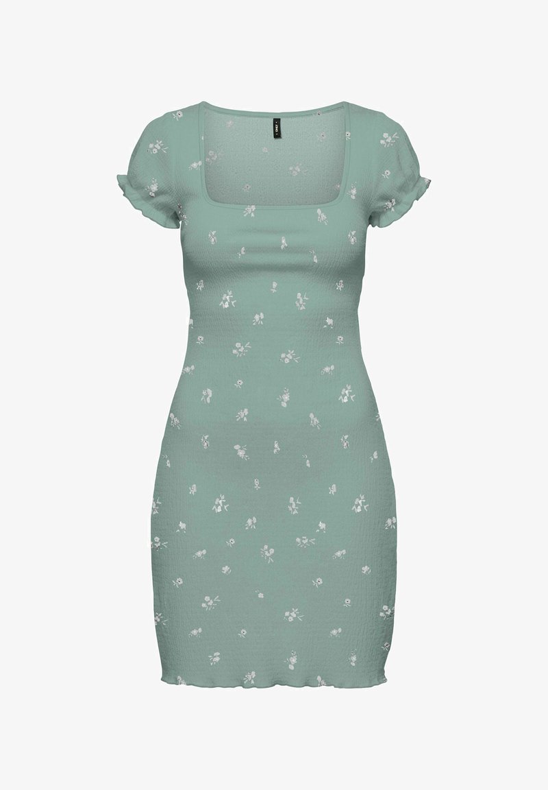 Robe ajustée vert clair avec manches courtes bouffantes, encolure carrée et petit motif floral blanc partout.