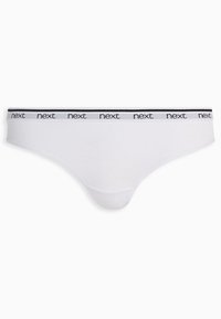 Bílé bavlněné tanga s černobílým elastickým páskem s logem. Hladká textura, minimalistický design.