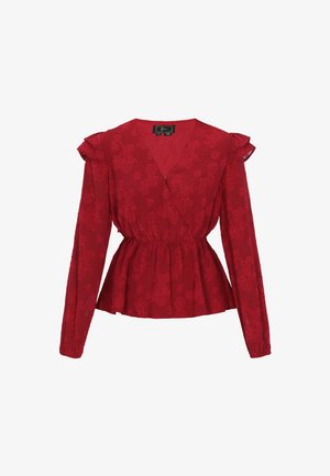 Piros virágmintás blúz hosszú ujjakkal, V-alakú dekoltázzsal, és ráncolt derékrésszel. Könnyű, strukturált anyag, fodros részletekkel.