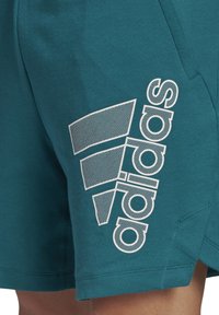 adidas Performance BADGE OF SPORT - Jogginghose - legtea