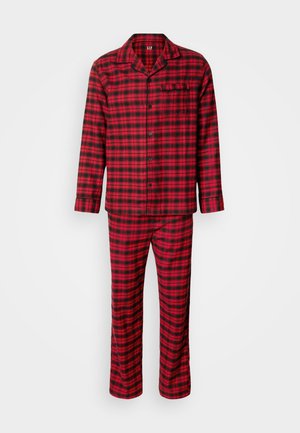 Röd och svart rutig pyjamas i bomull med knappupptagningsskjorta, långärmad, och matchande byxor. Har bröstficka på skjortan.