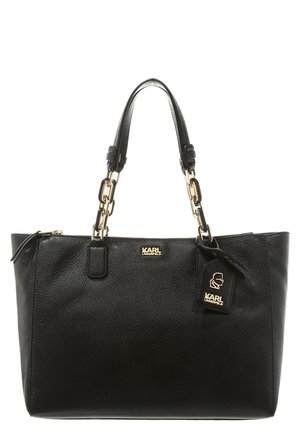 Black leather tote bag with gold chain and leather handles, featuring Karl Lagerfeld logo and hanging tag with logo silhouette.