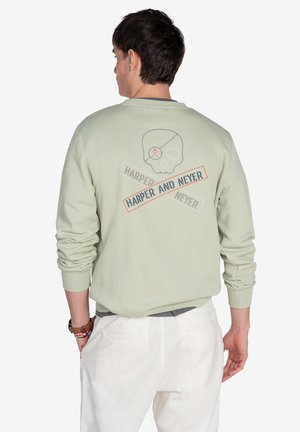 Sudadera verde menta con un gráfico de calavera y texto en la parte trasera, con un cuello redondo acanalado y puños, y un corte relajado.