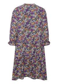 Robe fleurie à manches longues avec de petites fleurs multicolores en violet, blanc, orange et vert, vue de dos.
