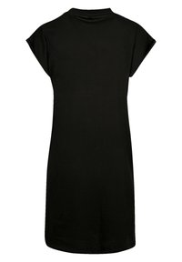 Schwarzes Baumwoll-T-Shirt-Kleid mit kurzen, umgeschlagenen Ärmeln, einem runden Ausschnitt und einer lockeren Passform. Der Stoff wirkt glatt und leicht.