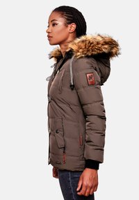 Brown padded jacket with a fur-lined hood, featuring zippered and snap button closures, side pockets, and ribbed cuffs.