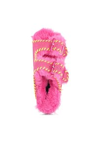 Fuzzy pink slippers with dual buckle straps, yellow stitching, and a plush interior. Circular and rounded shape with a soft texture.