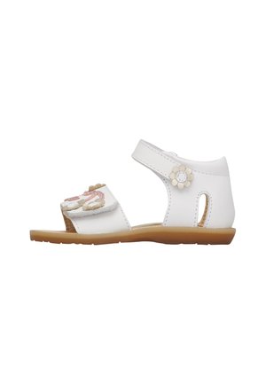 Sandalo bianco per bambino piccolo con cinturino alla caviglia, decorazioni floreali, punta aperta e suola flessibile marrone chiaro.