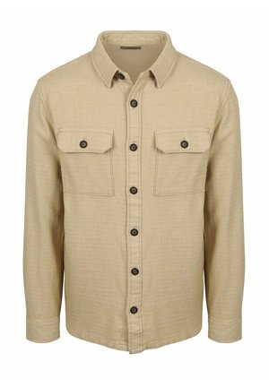 Beige overhemd met lange mouwen en knopen, twee borstzakken met klep, donkere knopen en een gestructureerde stof.