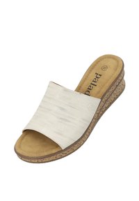 wedge sandal with a textured cream upper, suede insole, and a patterned cork-like sole. Features a slip-on design and subtle branding.
