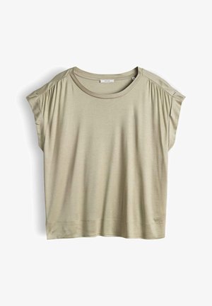 T-shirt beige a maniche corte dalla vestibilità ampia con scollo rotondo e leggero raccoglimento sulle spalle, distesa su uno sfondo bianco.