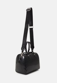 Black handbag with a glossy, textured finish, featuring the "Valentino" logo embossed, dual handles, and a detachable shoulder strap.