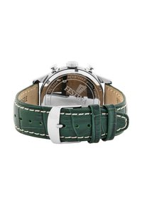 Correa de reloj de cuero verde con patrón de cocodrilo y costuras blancas, caja de acero inoxidable y fondo transparente que muestra el movimiento.