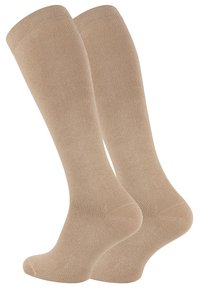 Calze beige al ginocchio realizzate in un morbido materiale testurizzato, caratterizzate da un design senza cuciture e punta rinforzata per una maggiore durata.