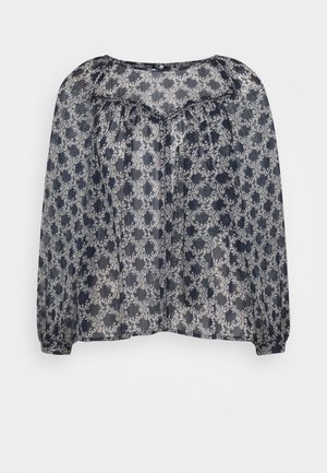 Marineblaue transparente Bluse mit weißem Blumen-Kreis-Muster, langen, gepufften Ärmeln, gerafftem Einsatz und rundem Ausschnitt.