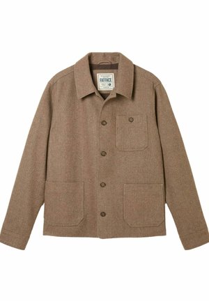 Brūna zivju kaula raksta žakete ar krekliņa apkakli, pieciem priekšējiem pogu aizdares elementiem, vienu krūšu kabatu un divām priekšējām kabatām. Izgatavota no teksturēta vilnas auduma.